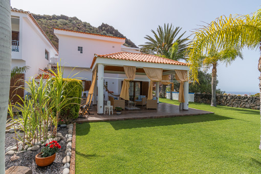 Main house surrounded by a tropical garden