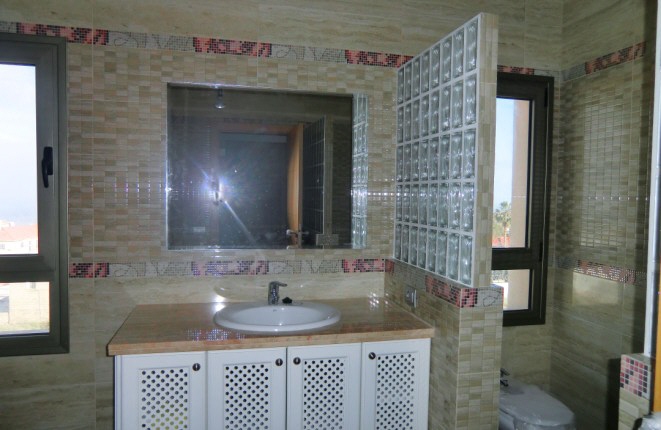 Large bathroom with rain shower, toilet and bidet